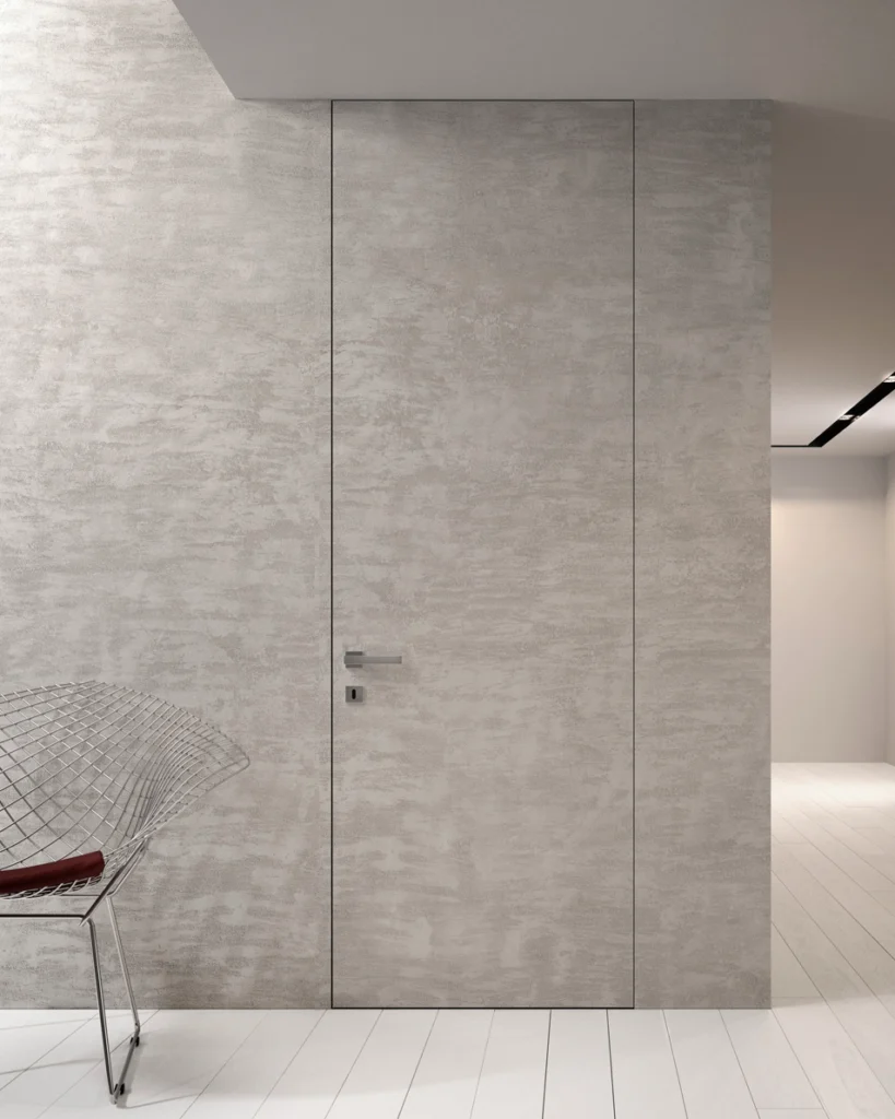 Graue wandbündige Türen mit zargenloser minimalistischer Beton-Optik